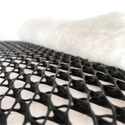 Réseau de drainage composite pour gazon artificiel