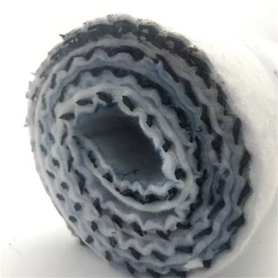 Réseau de drainage composite pour gazon artificiel
