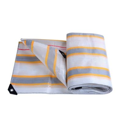 Étanche à l'eau et lourde, bâche à rayures jaunes, parfaite pour protéger les parapluies extérieurs.